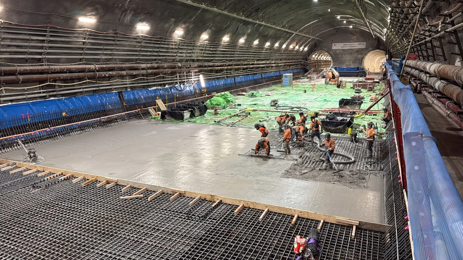 Crews placing a deck pour inside the Sydney Metro tunnel at Pyrmont East
