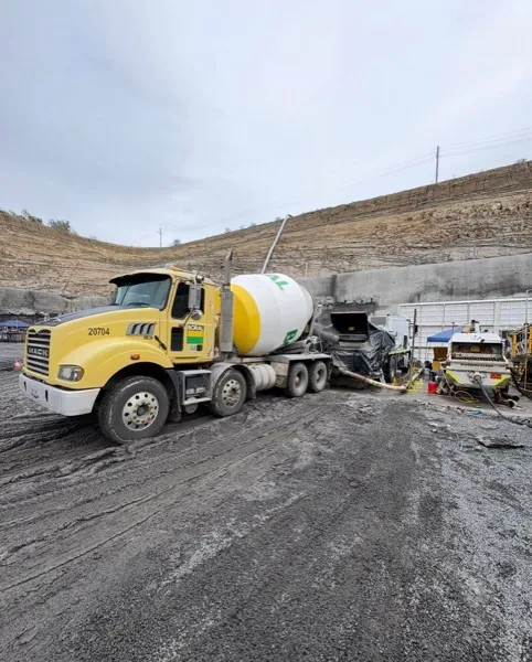 Agitator trucks feeding the pump for underground mine drift pours
