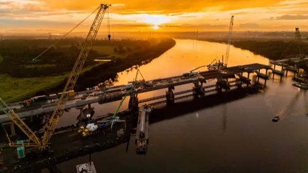 Pumping over the water on a river crossing at sunrise