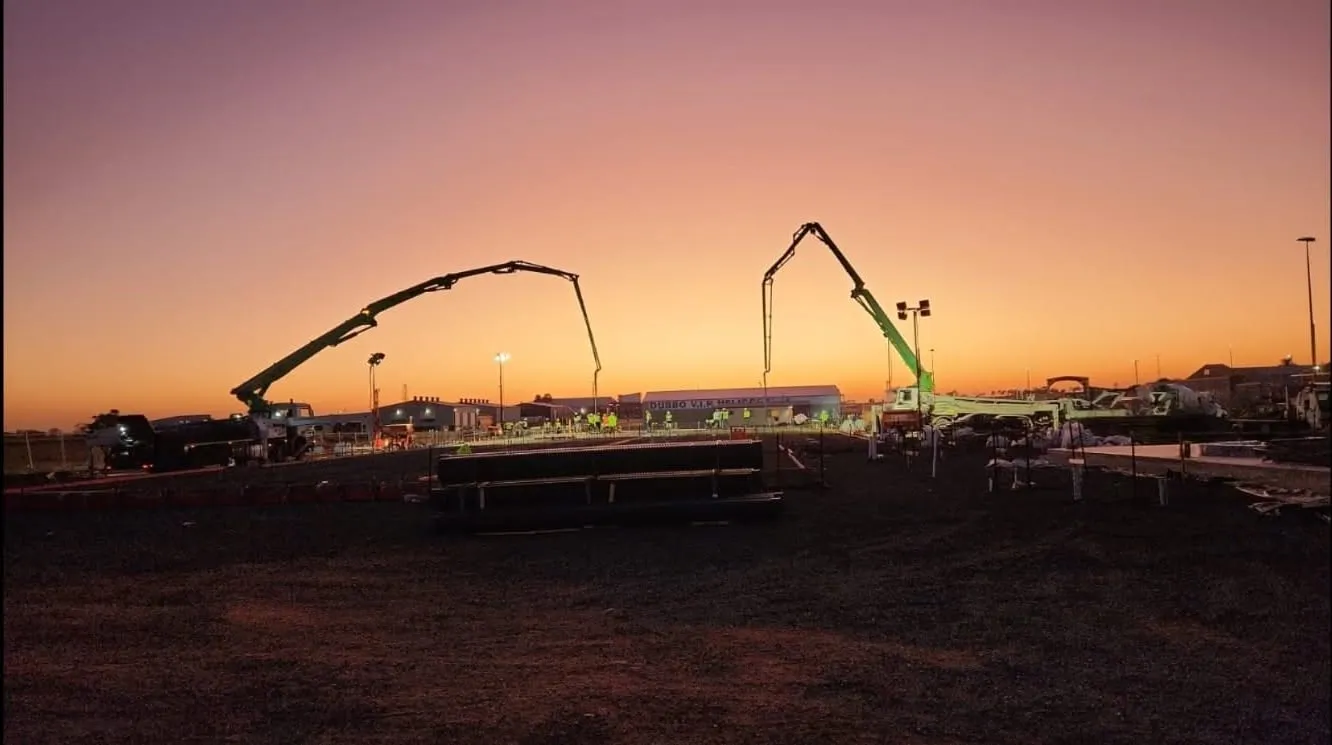 Two of the booms working at first light